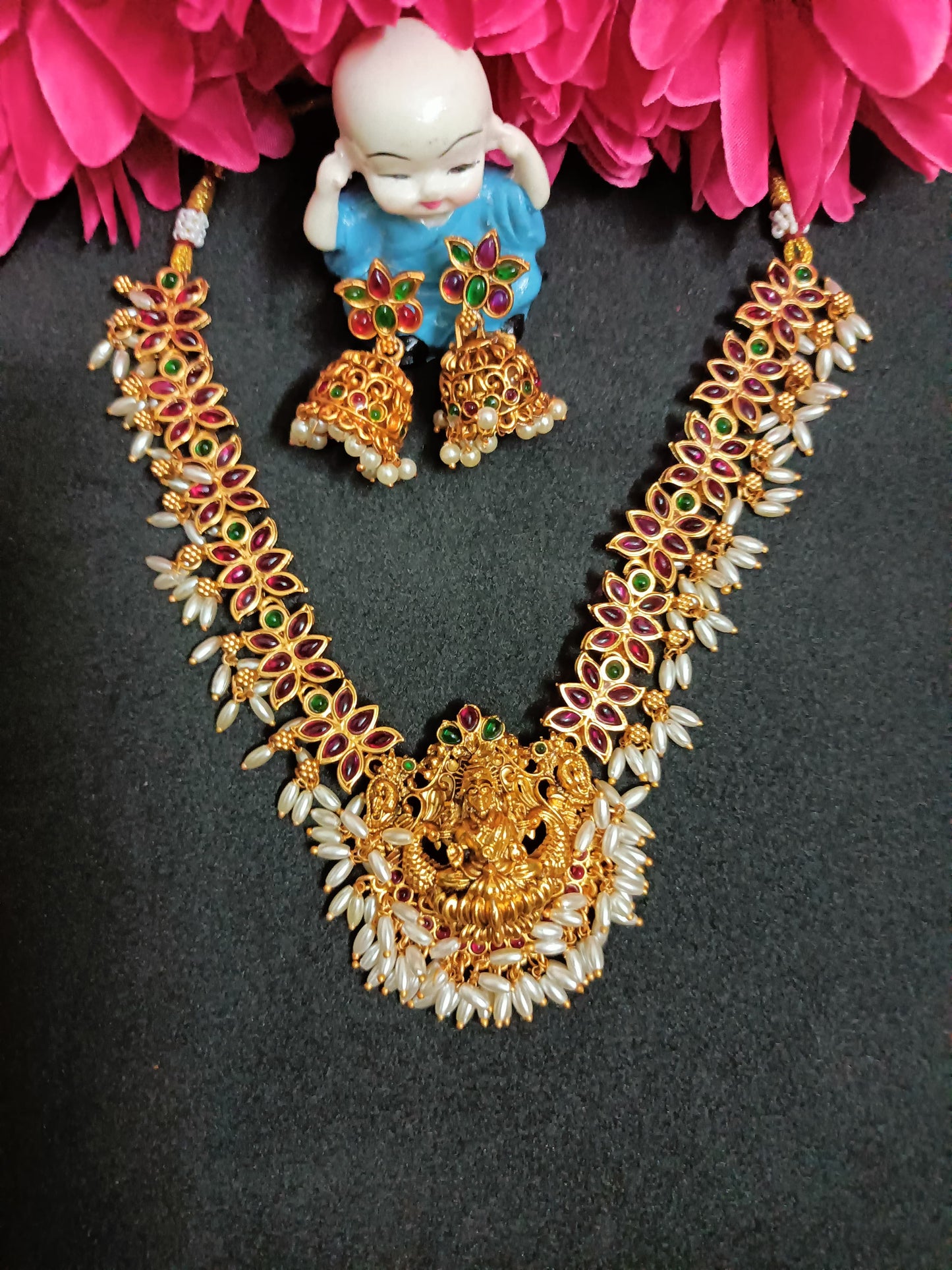 Lakshmi Pendant with Hanging Pearls Necklace with Earrings .